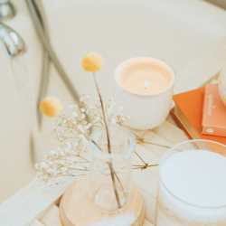 Self confence practices for a stronger you with a vase with flower and a candle